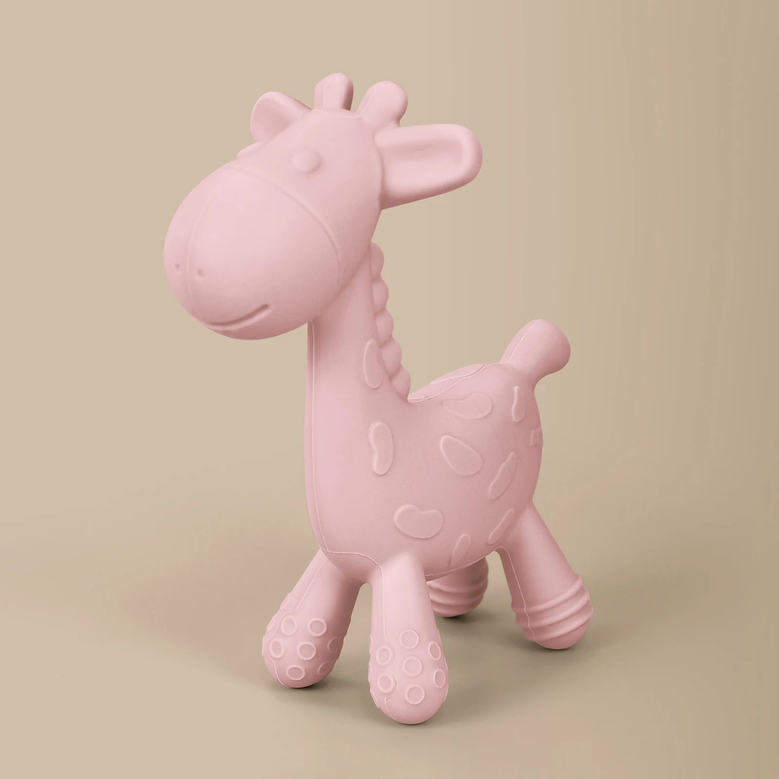 Pink giraffe-shaped toy on a beige background
