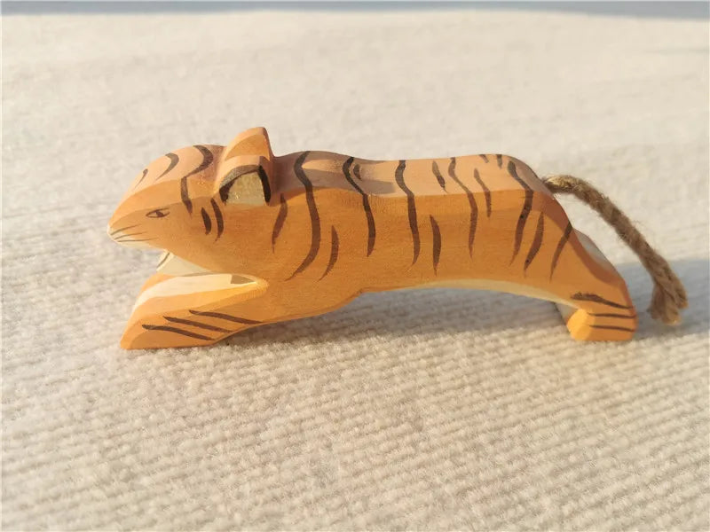 Wooden tiger toy on a textured surface