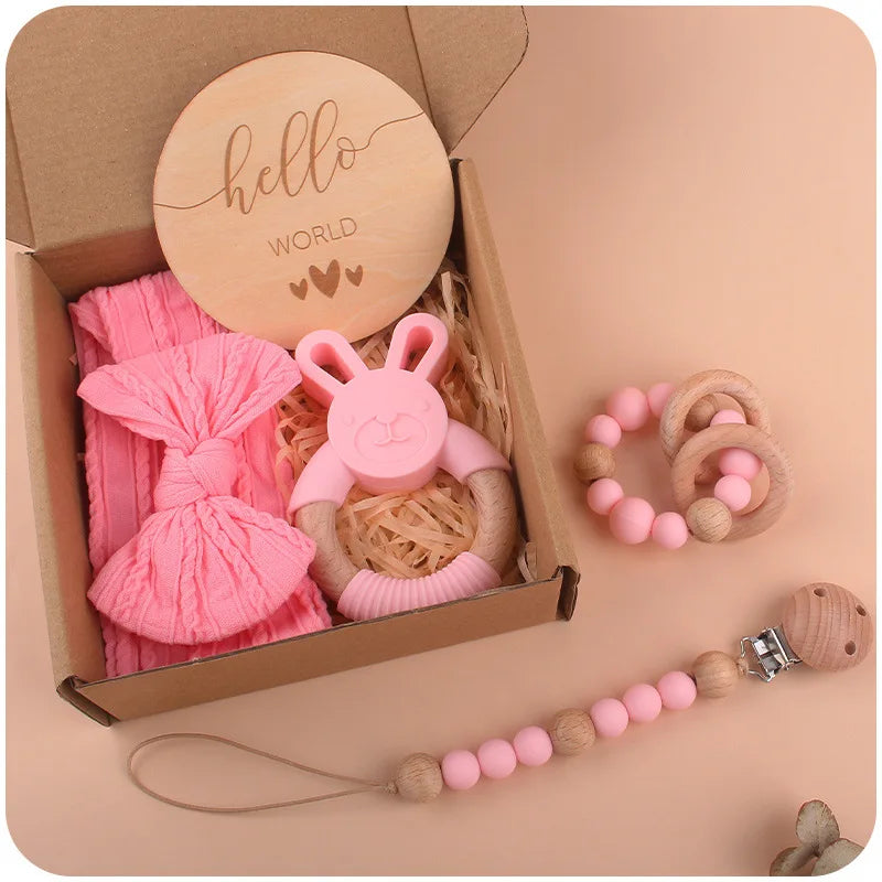 Baby Silicone Teether Newborn Gift Set includes a pacifier chain, rabbit and round teethers, baby hairband, and wooden card, perfect for infant care and play.