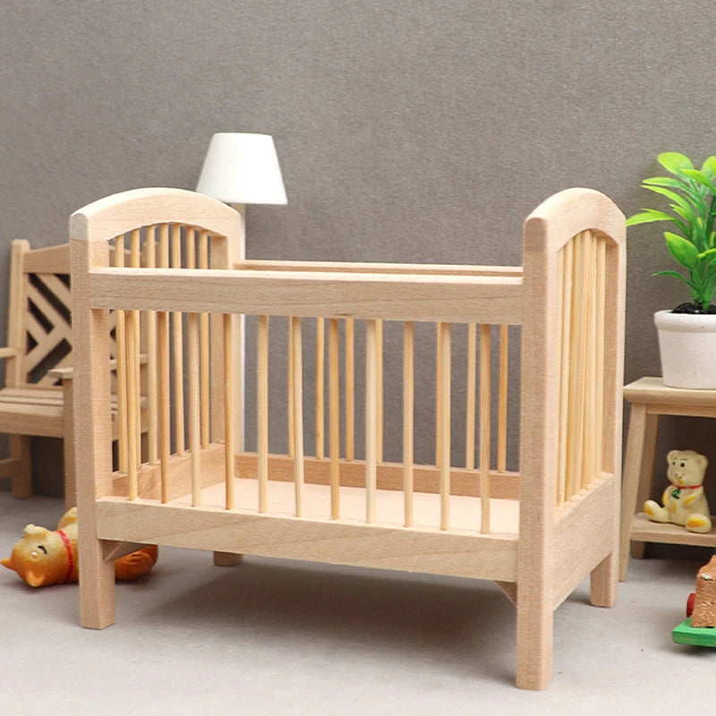 Wooden crib in a room with toys and a lamp