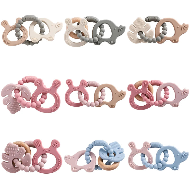 Set of colorful baby teething toys on a white background