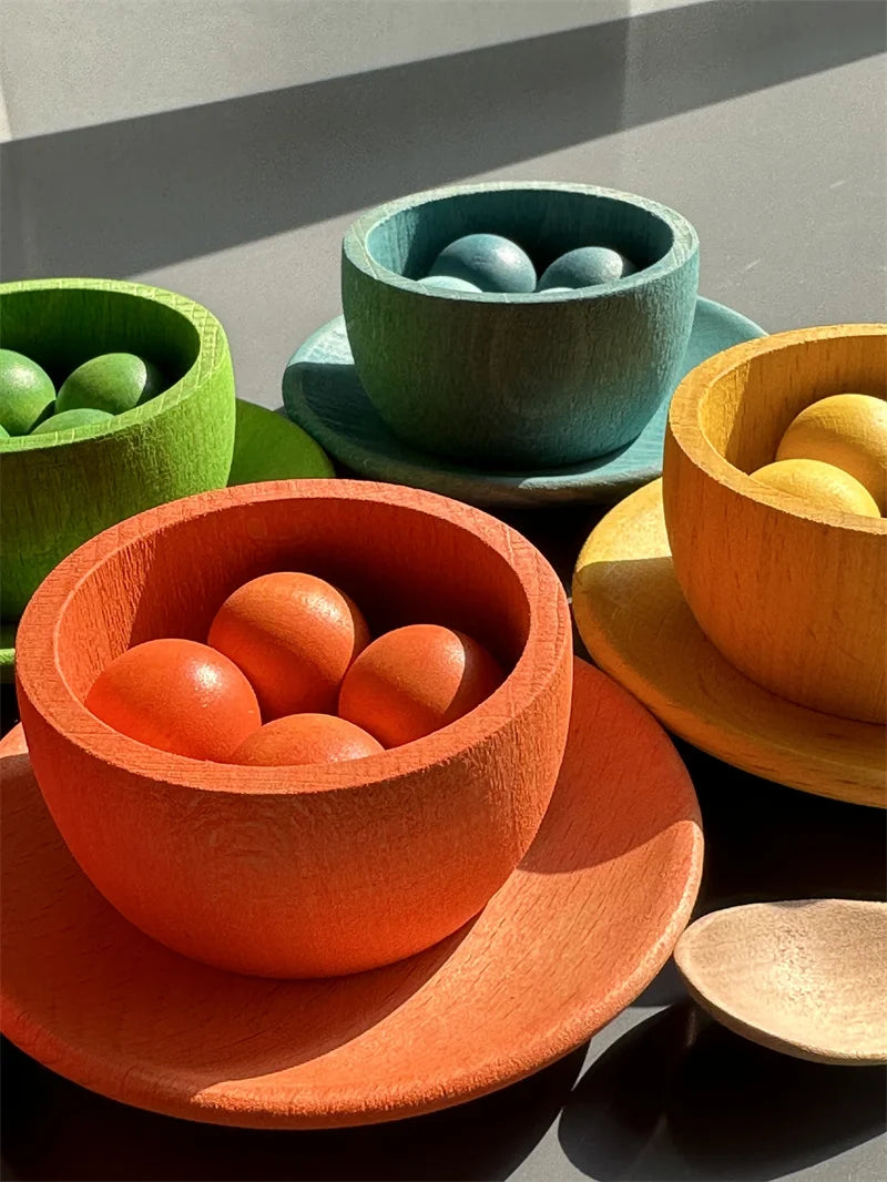 Collection of wooden bowls with colorful contents on a gray surface