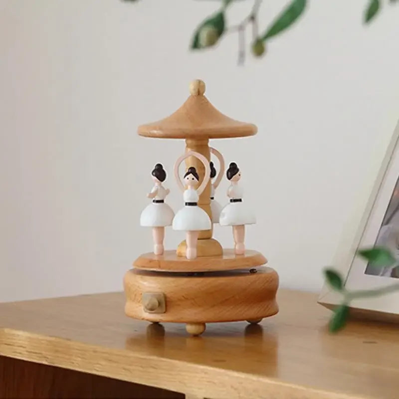 Wooden music box with figurines on a wooden surface | Oliver & Company Montessori Toys