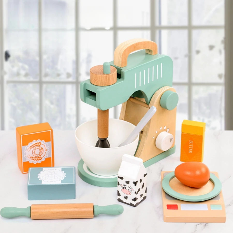 Wooden kitchen playset with mixer, bowls, and utensils on a light surface.