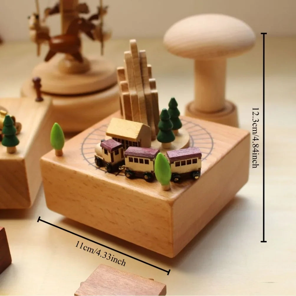 Wooden music box with train and tree design, featuring measurements on a light background.