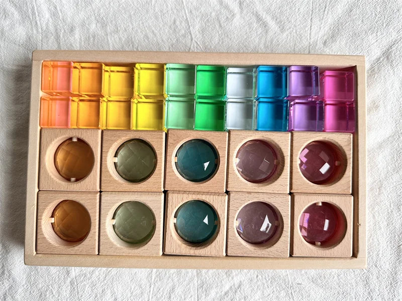 Colorful wooden block set with round pegs and rectangular slots on a light background