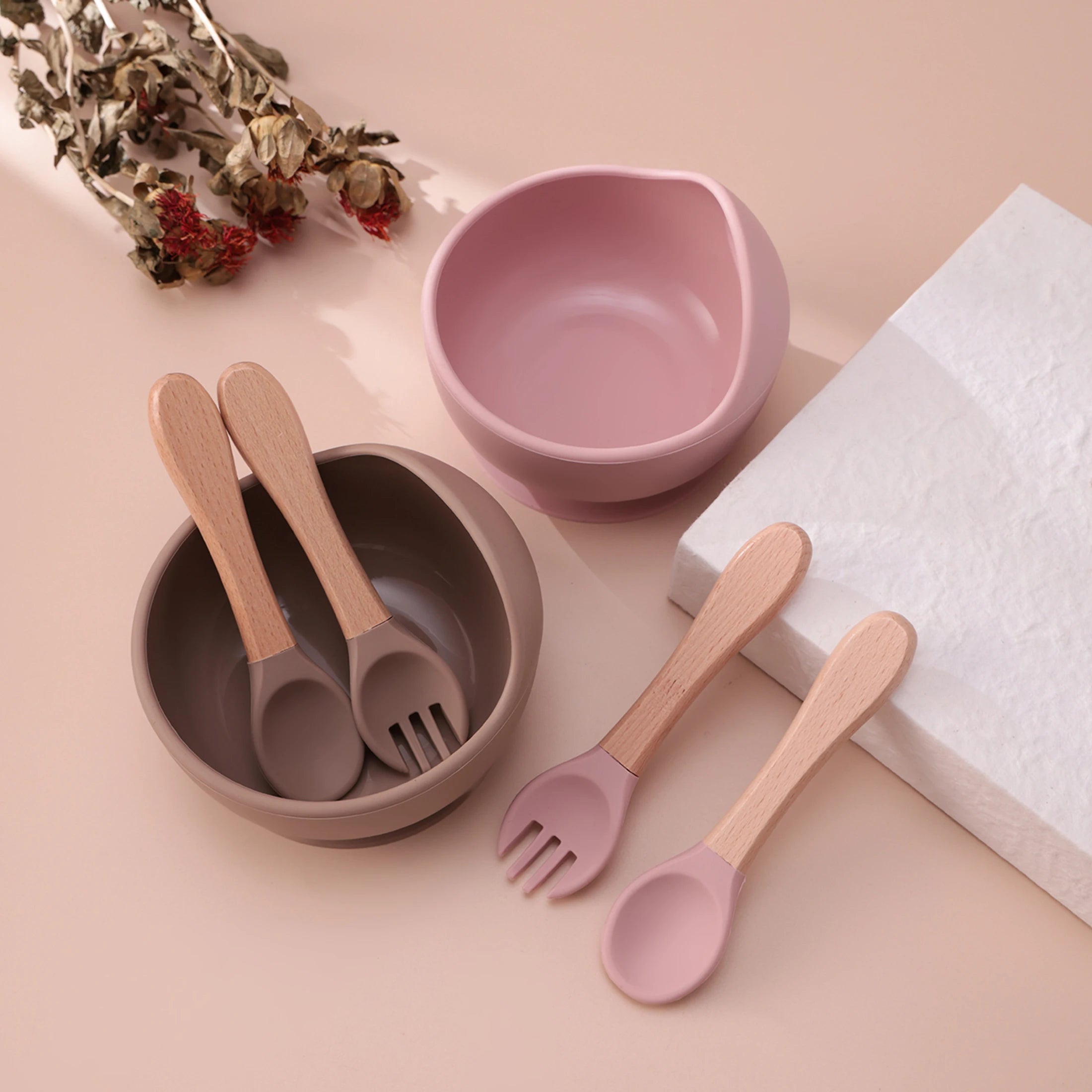 Dusty rose and taupe suction bowls with wooden spoons and forks