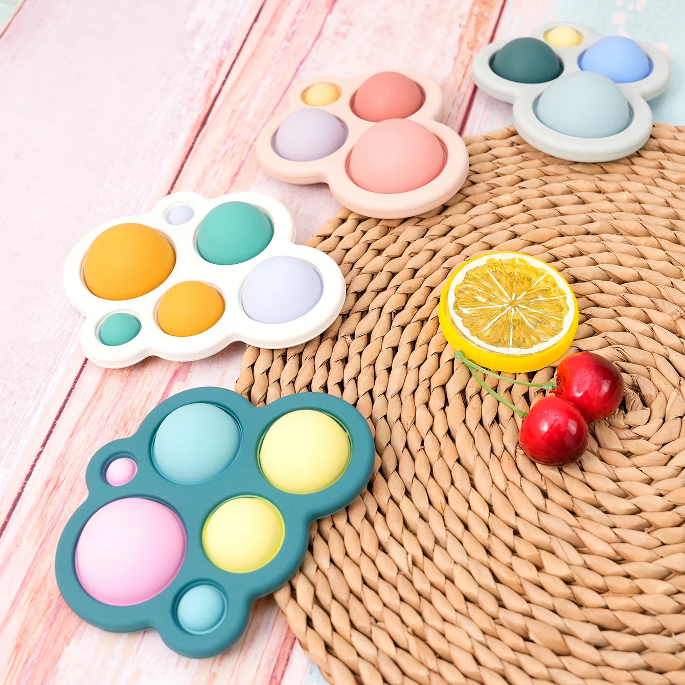 Bubble pop silicone teethers in bright colors with fruit