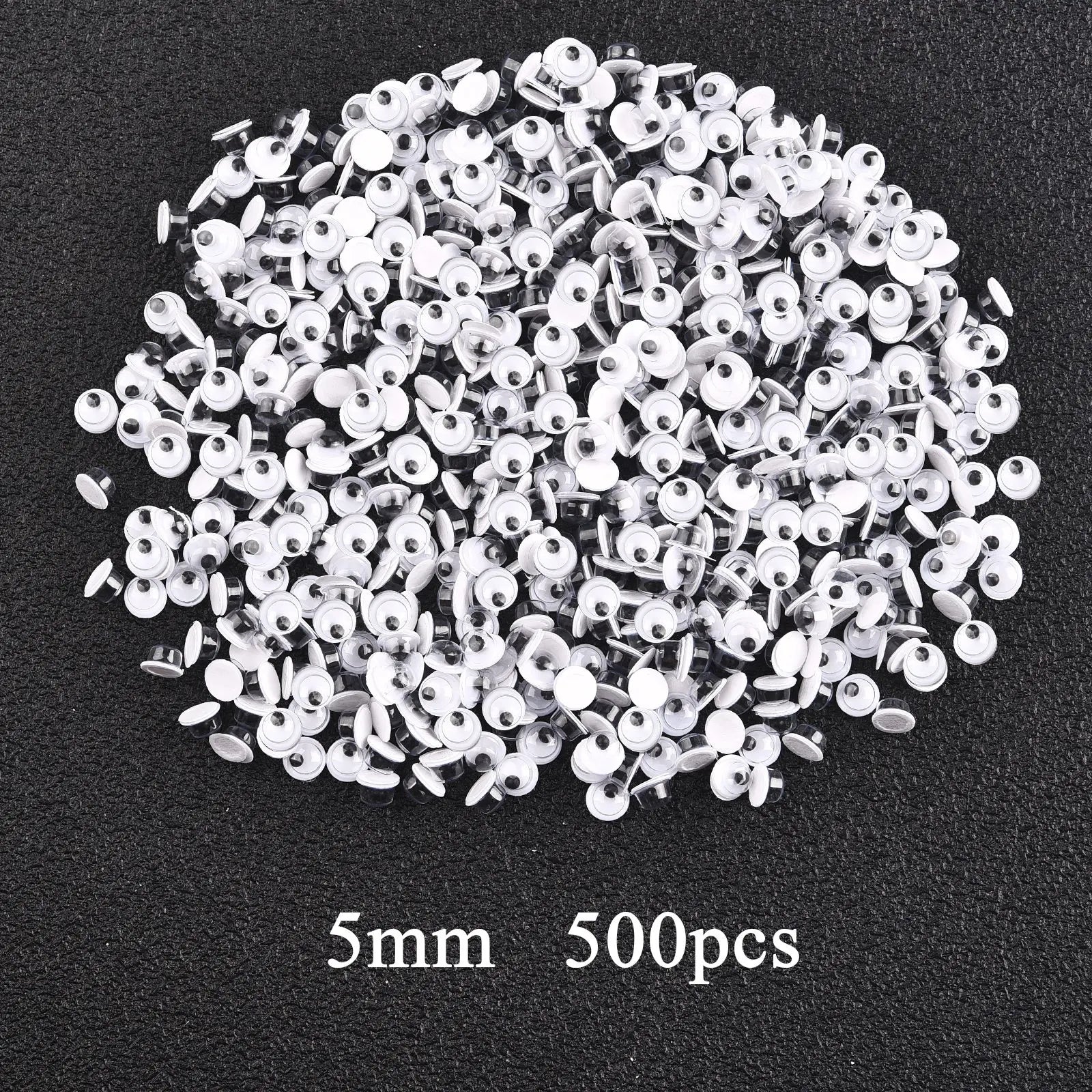 Movable Googly Eyes - Kindergarten Craft Supplies: A pile of assorted white plastic googly eyes, ideal for enhancing children's art projects and creative play.