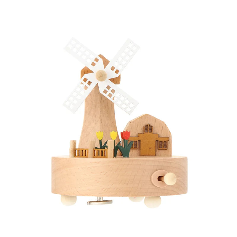 Wooden music box with windmill and house design on a white background