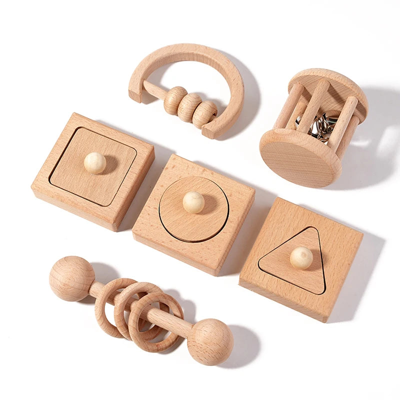 Set of wooden baby toys on a white background