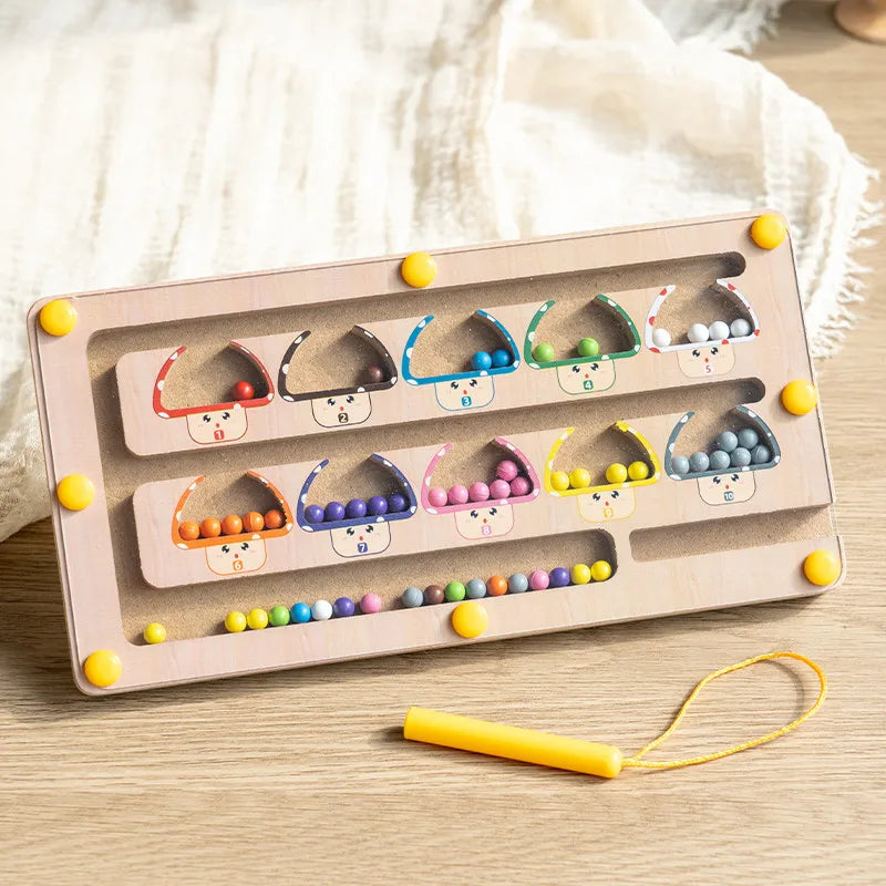 Color sorting toy with beads and wooden frame on a light surface