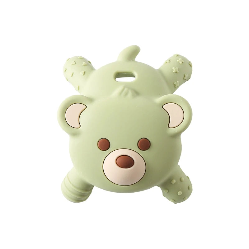 Green teddy bear-shaped object on a white background