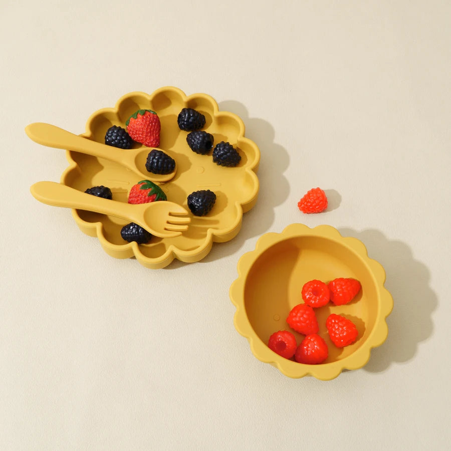 Yellow silicone pie mold with berries on a beige background