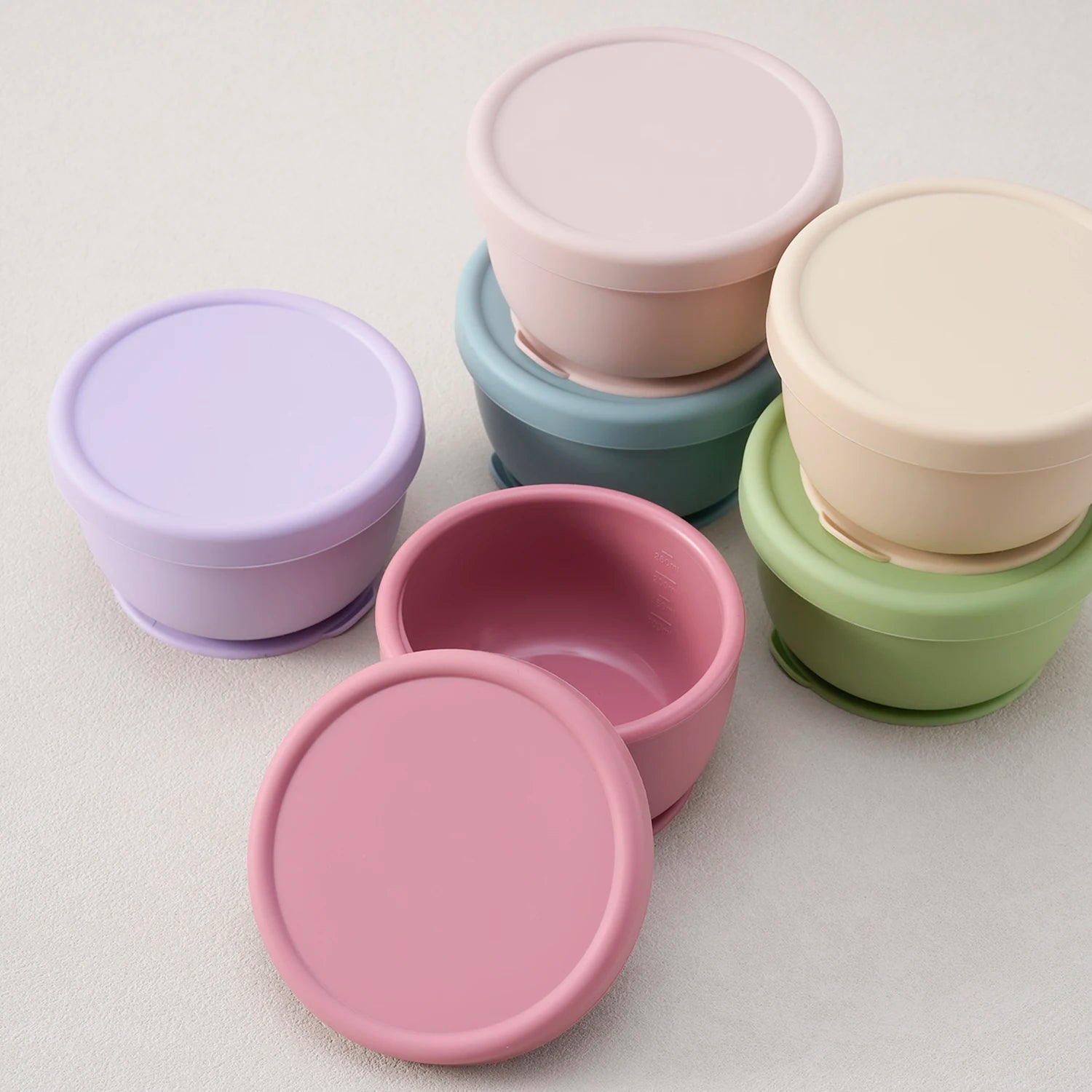 Silicone suction bowls with lids in lavender, rose, cream, green and blue