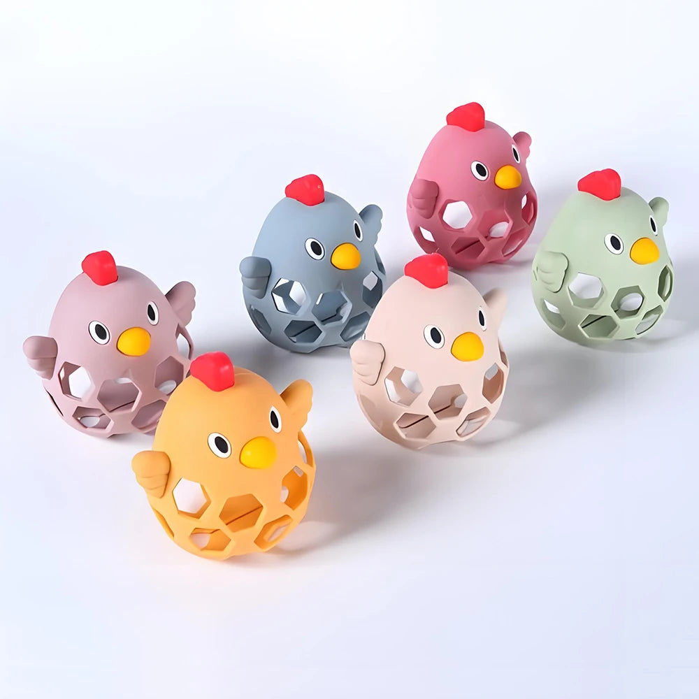 Set of colorful chicken-shaped toys on a white background