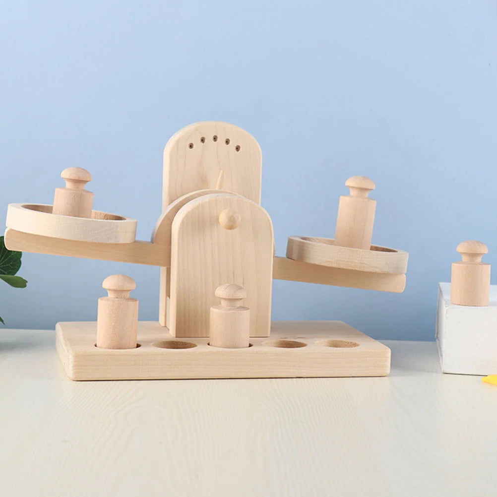 Wooden Balance Scale Toy on table with weights, designed for educational play, fostering creativity and learning through interactive balance exercises. Ideal for children’s developmental skills.