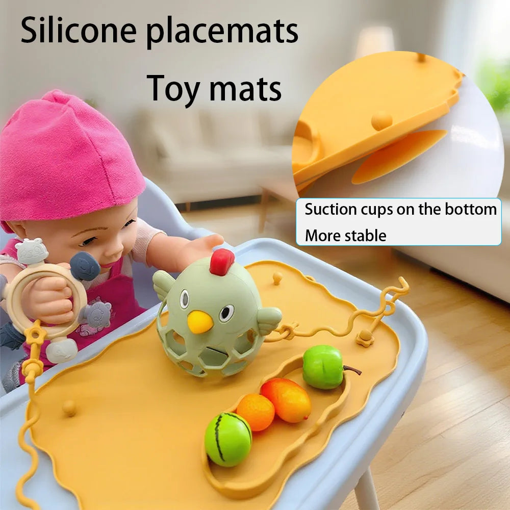 Mustard mat on a high chair with a toy on a strap and suction cups underneath
