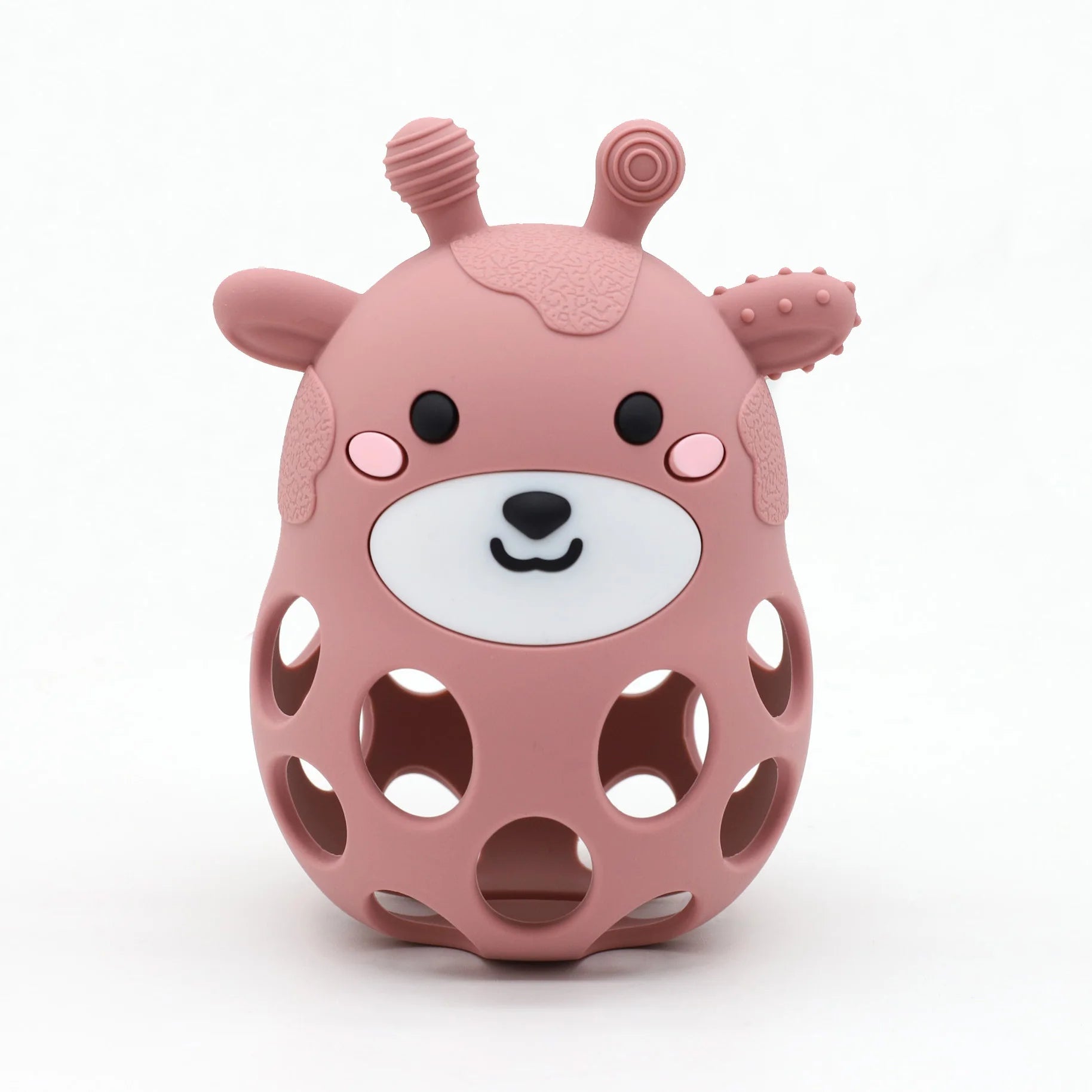 Pink bear-shaped toy with a white face on a white background