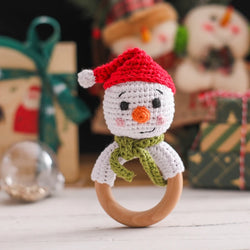 Crochet Snowman & Reindeer Rattle Toy featuring a crocheted snowman and wooden teether, designed to captivate infants with festive charm and gentle rattle sound.