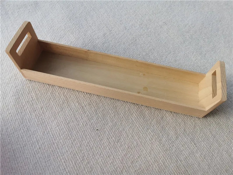 Wooden tray on a textured gray surface