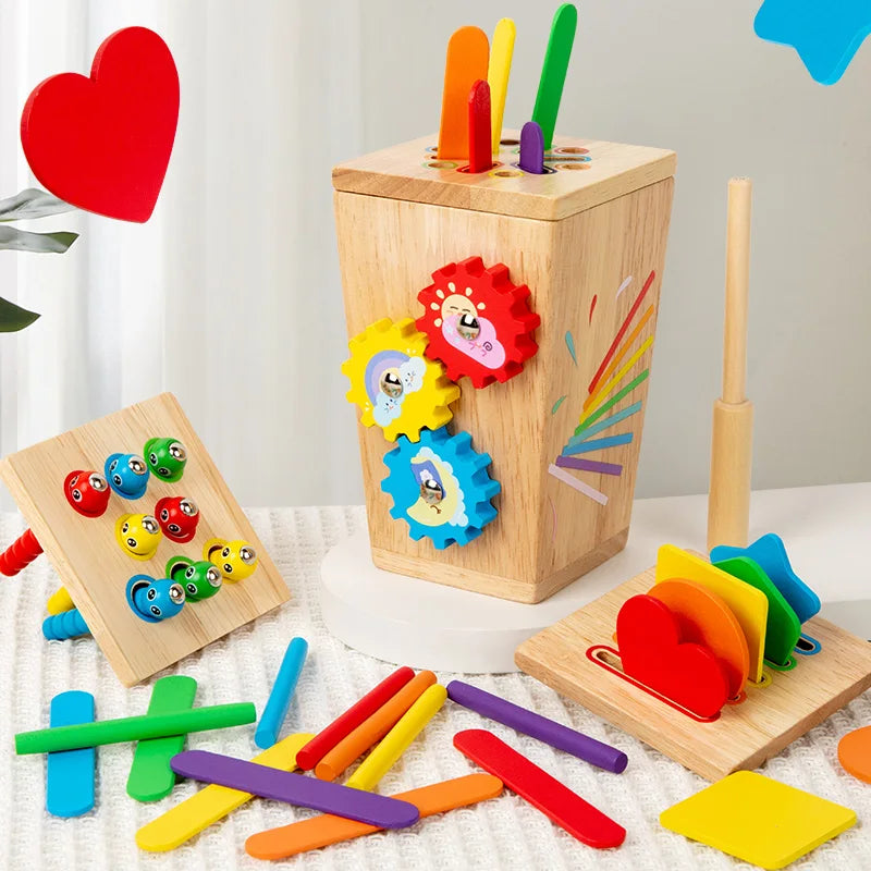 Set of colorful wooden educational toys on a light surface with a white curtain background.