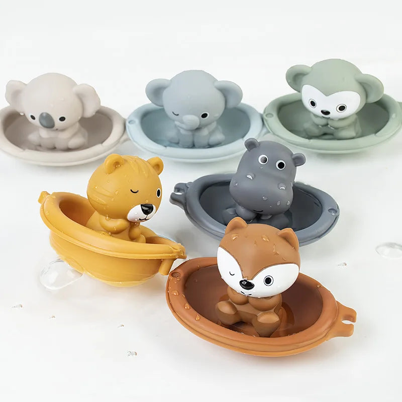 Set of six animal-shaped silicone bath toys on a white background