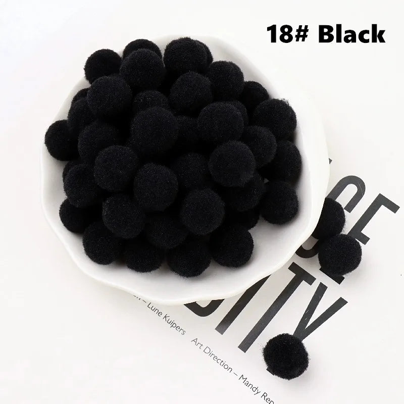 Black pom-poms in a white bowl on a newspaper background