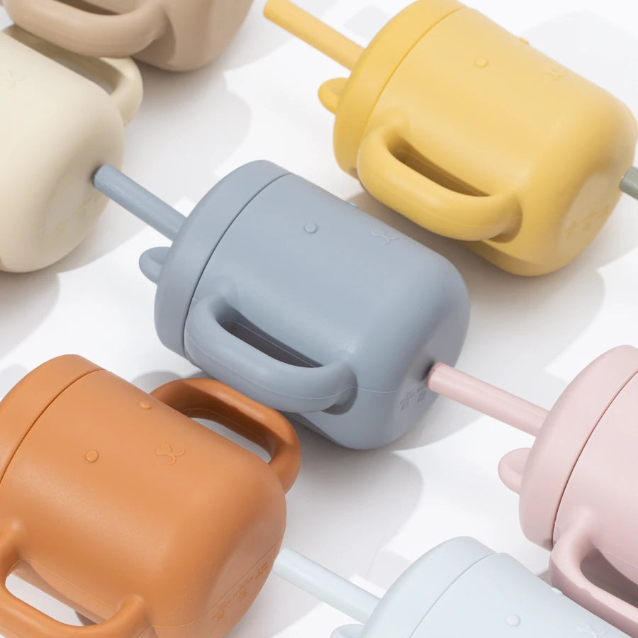 Close-up of grey blue bear straw cups and lids