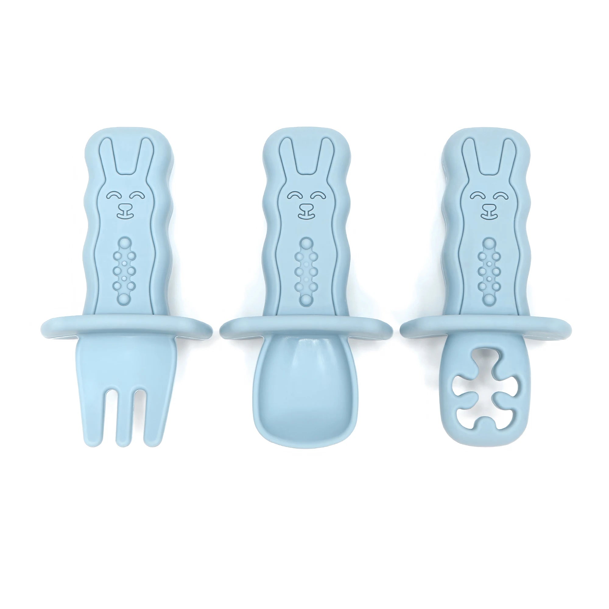 Three blue baby utensils with rabbit designs on a white background