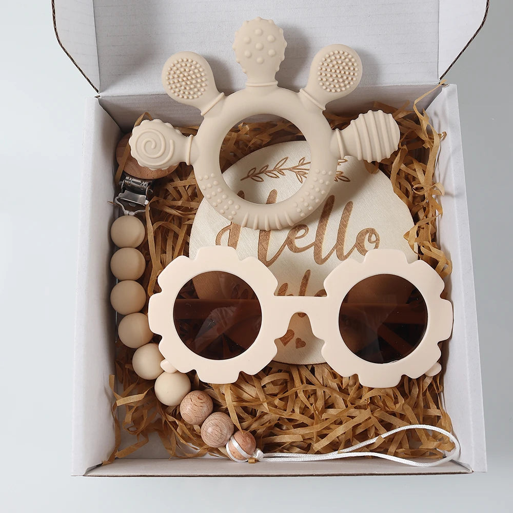 Baby teether with 'hello' text and sunglasses in a gift box