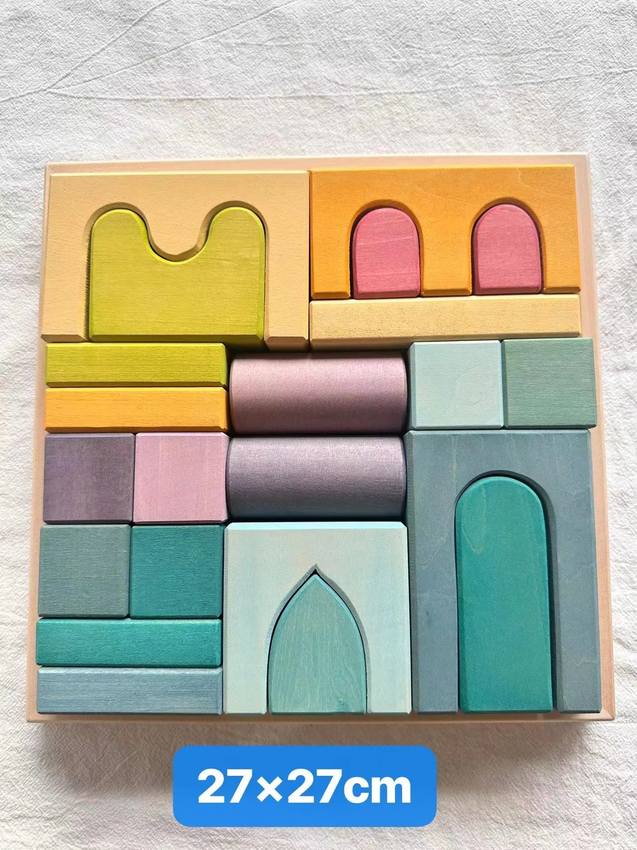 Colorful wooden block set with geometric shapes on a light gray background, size 27x27cm.