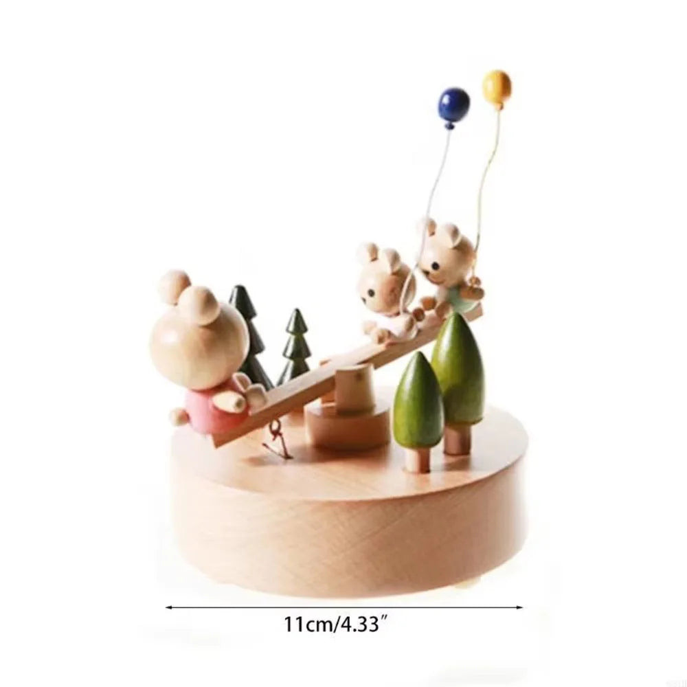 Wooden toy with animals on a seesaw, featuring trees and a measurement label.