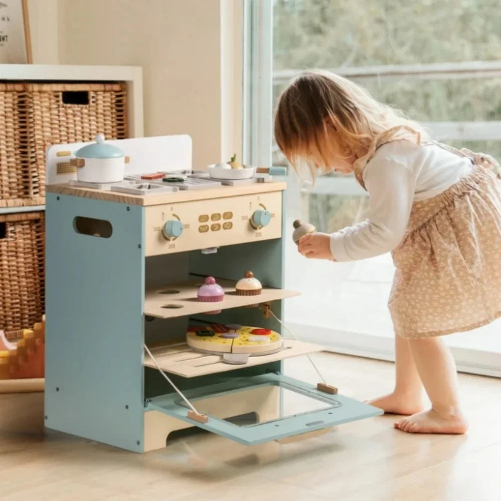 Child playing with a toy kitchen set indoors