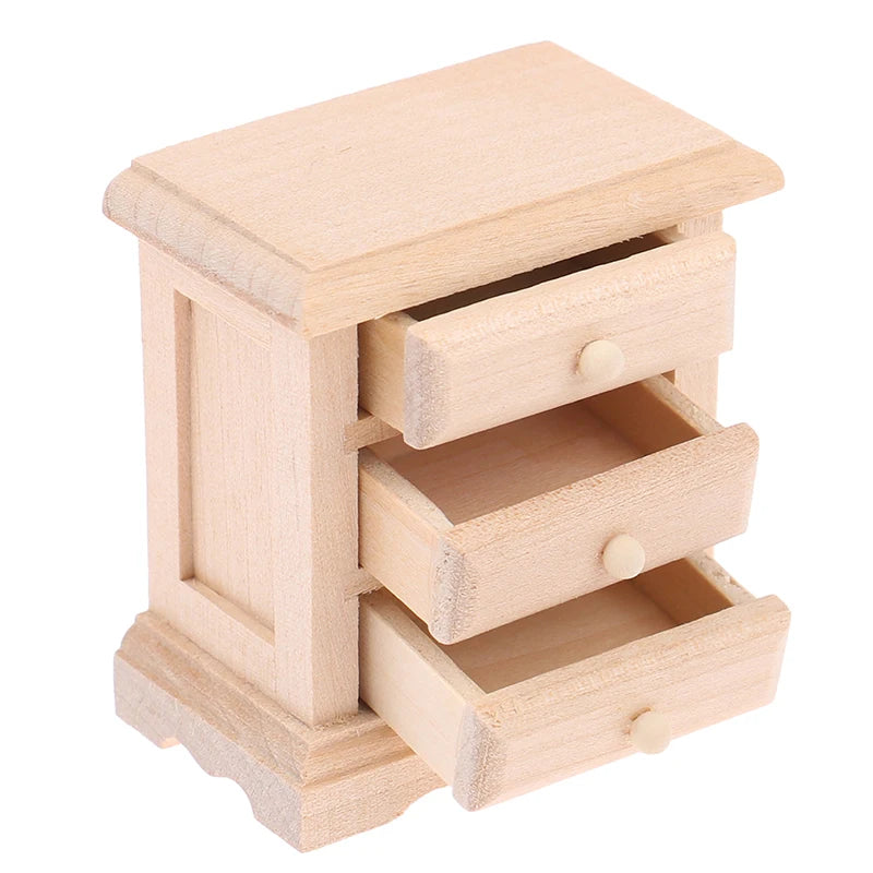Wooden toy dresser with three drawers on a white background Oliver Montessori Toys