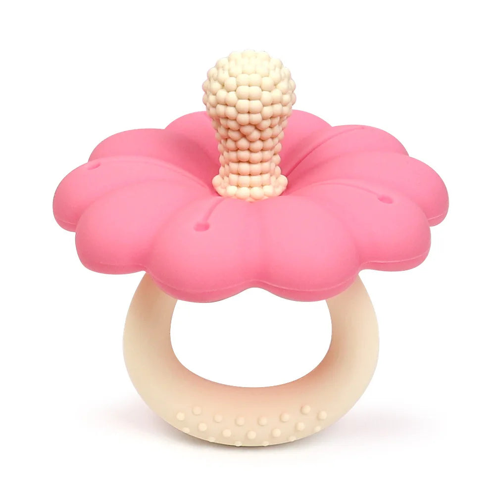 Pink and beige teething ring with flower design on a white background