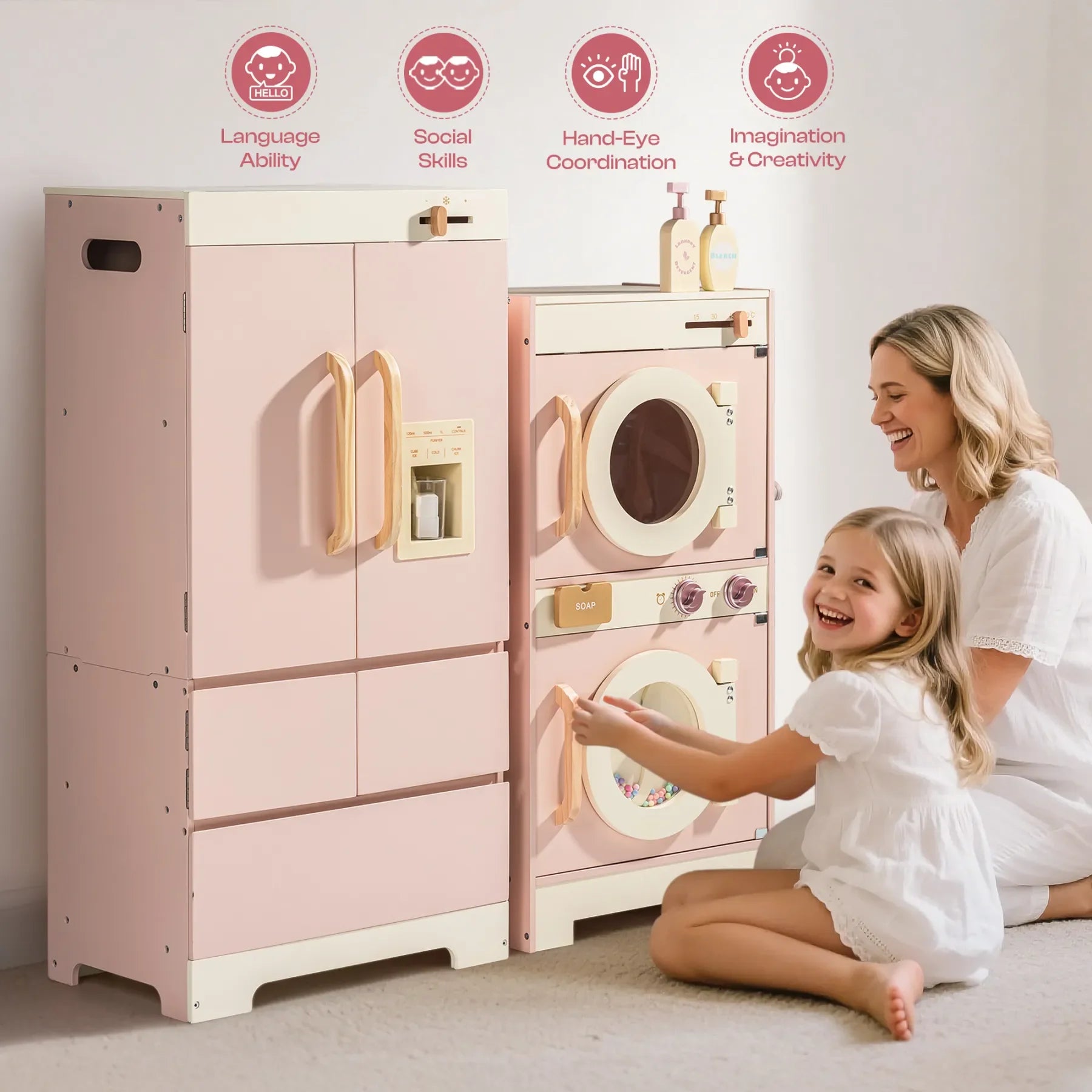 Pink toy kitchen set with a refrigerator and washing machine, featuring a child and adult playing together.