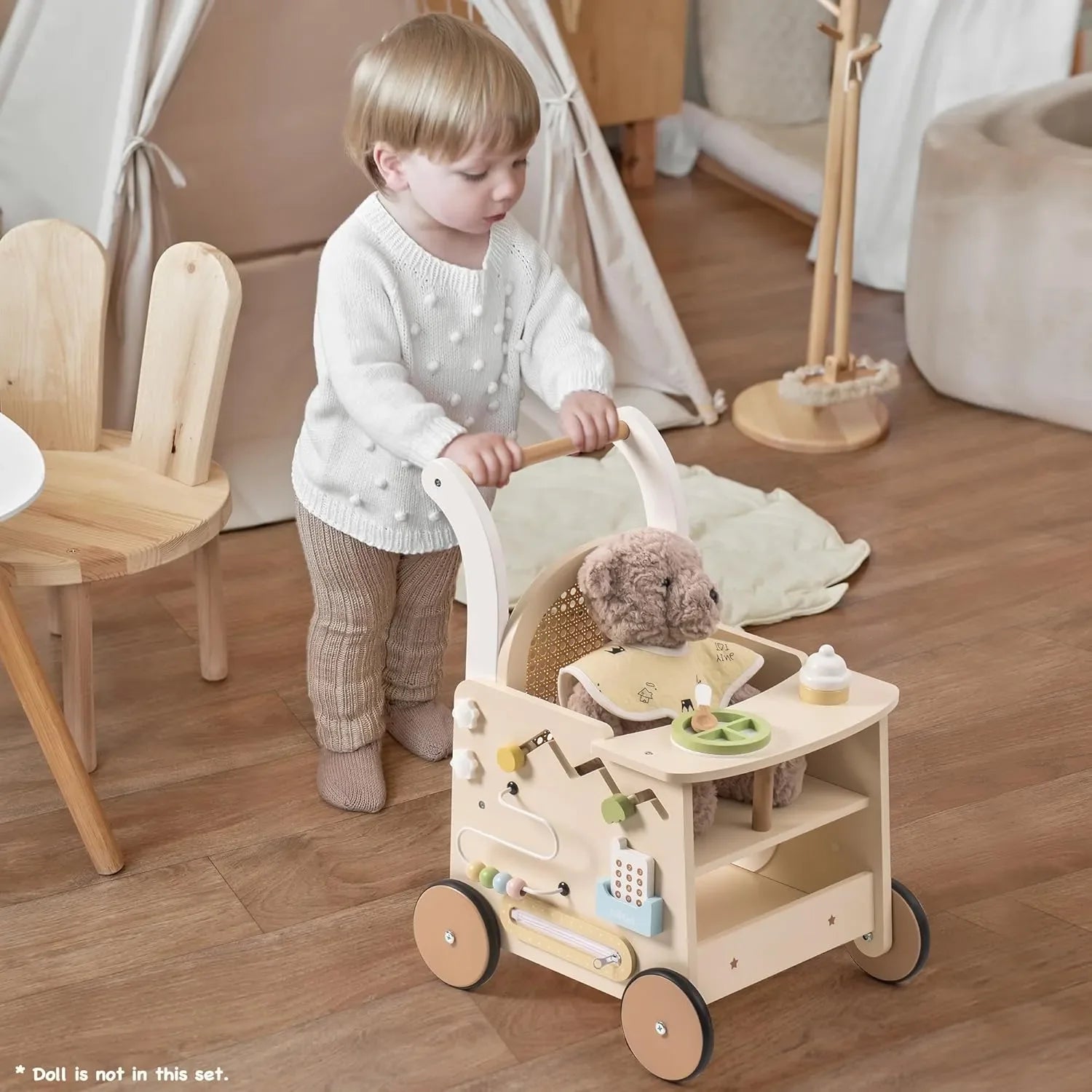 Child playing with a wooden toy cart in a cozy room.