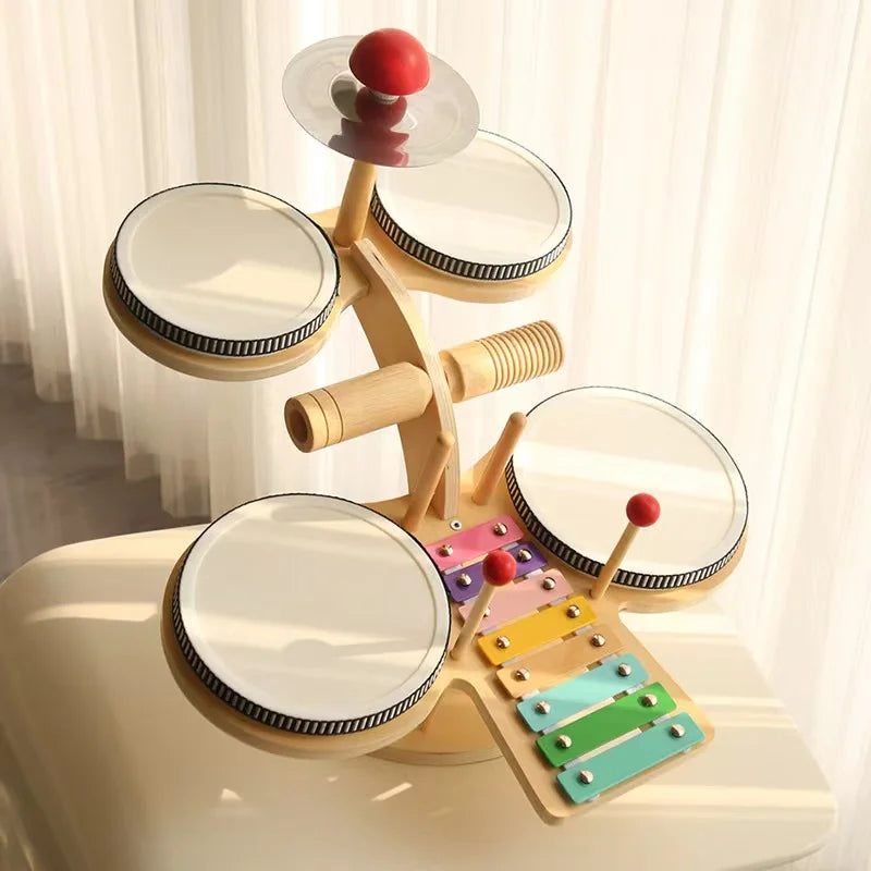 Kids Montessori Wooden Multi-Functional Drum Music Station with xylophones and rhythm sticks, promoting auditory development and creativity in children, crafted from child-safe materials.