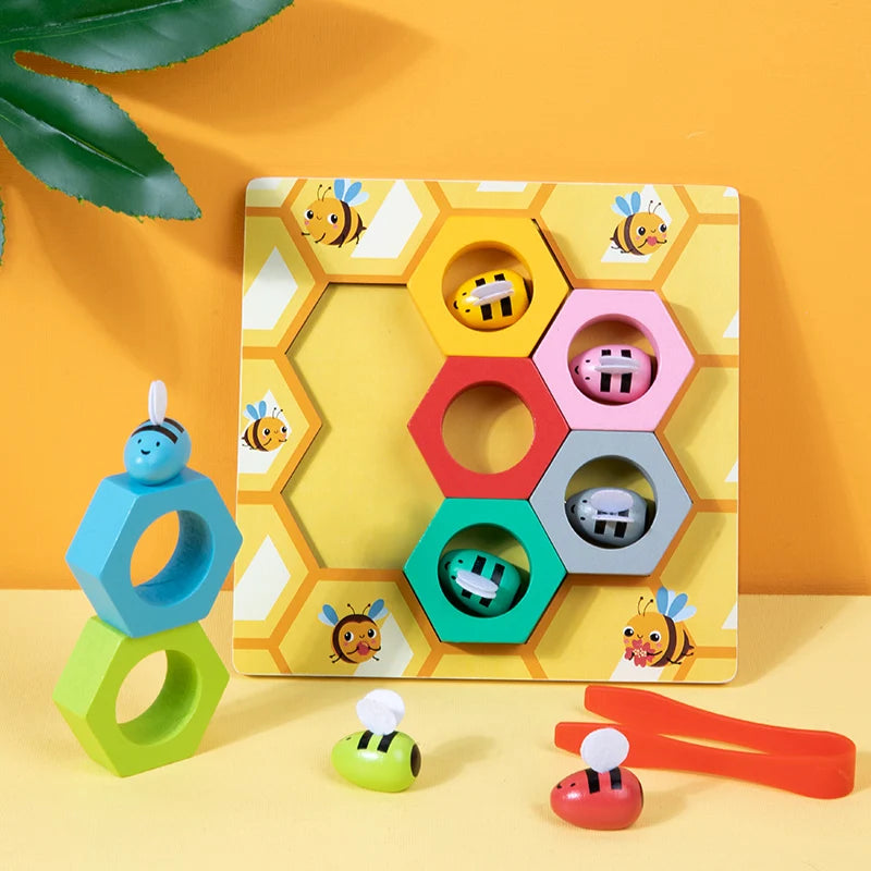 Colorful geometric shape sorting toy with bee design on a yellow background