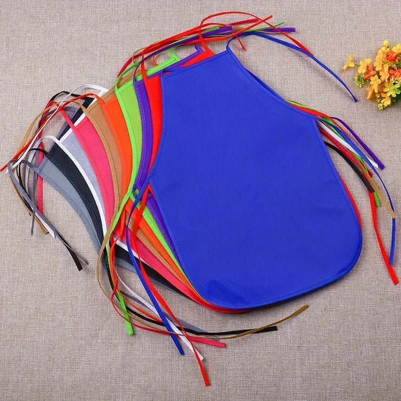 Blue apron with colorful tassels on a textured surface