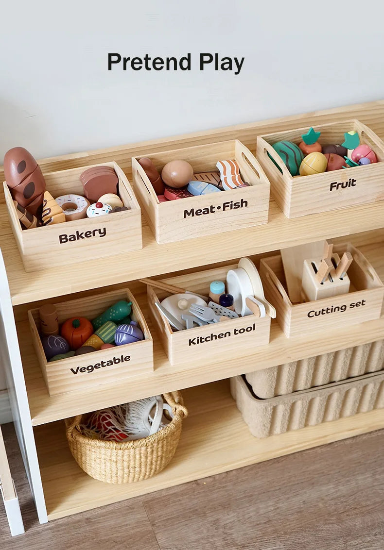 Wooden toy storage unit with labeled bins containing pretend play items.