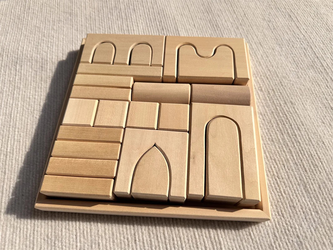Set of wooden building blocks on a textured surface