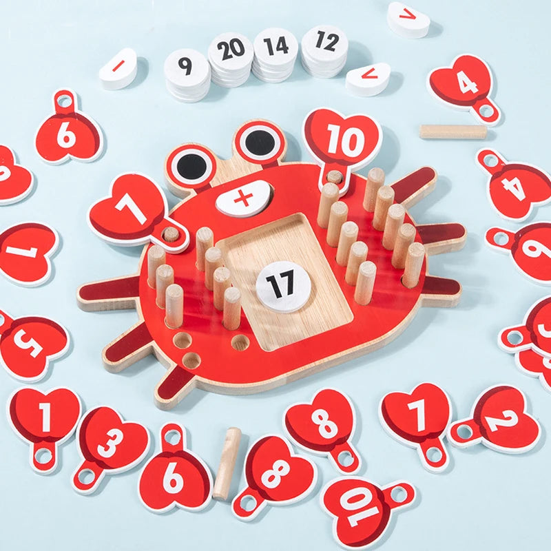 Children's educational game with red crab-shaped board and numbered red tags on a light blue background