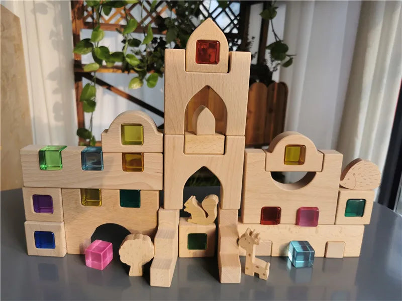 Wooden building blocks with colorful transparent windows on a reflective surface.