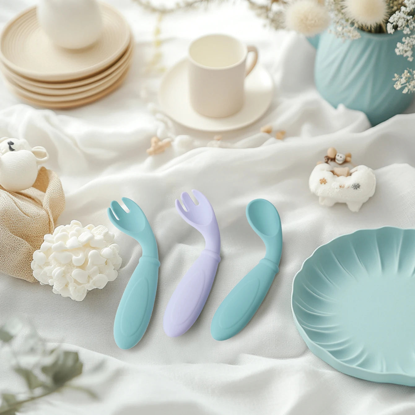 Aqua and lavender curved spoons and forks on a cloth