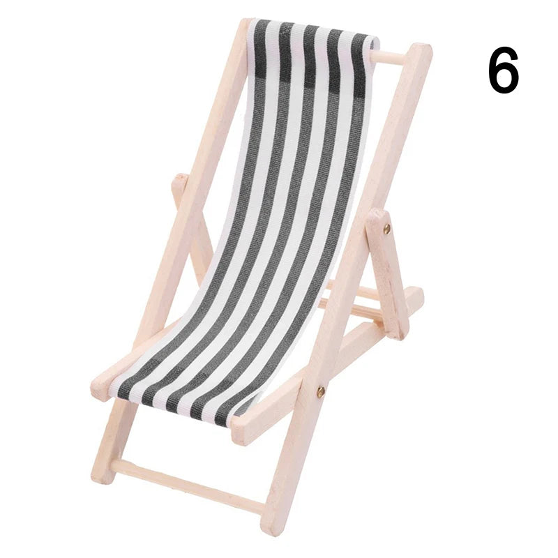 Striped folding beach chair on a white background