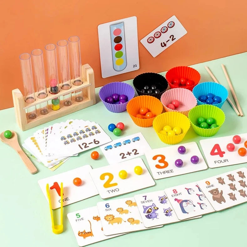Montessori Clip Beads Test Tube Game with colorful beads in cupcake wrappers, wooden spoon, and educational components for skill development in children over 3 years old.