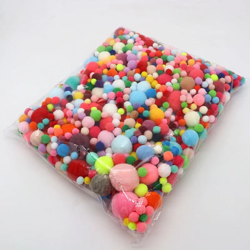 8-30mm Mixed High Elasticity Soft Pompoms for crafts, displayed in a colorful pile, ideal for creative projects and educational play at Oliver & Company Montessori Toys.