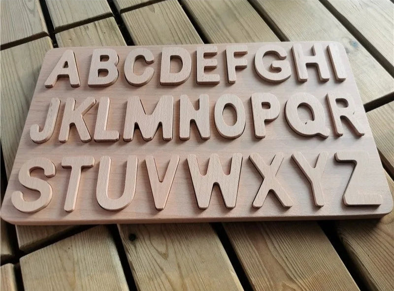 Wooden alphabet letters on a wooden surface